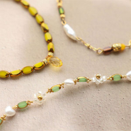 Novità Nuove perline di vetro ovali con bordo dorato